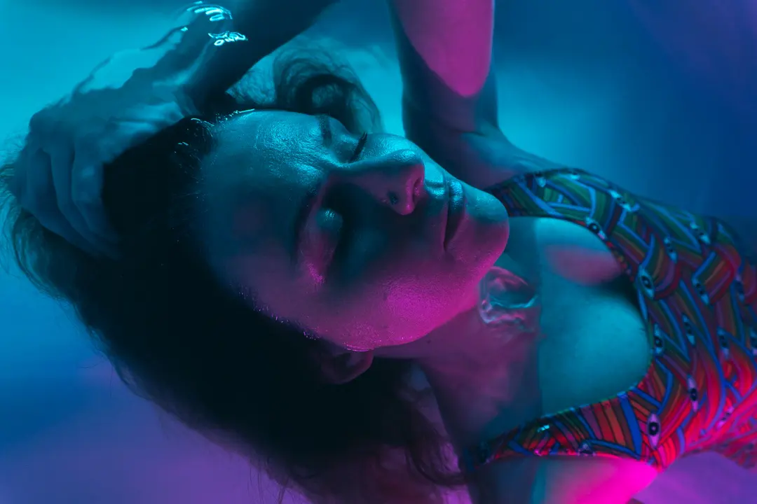 A FLOAT ONE guest preparing to enter the illuminated Orbit float pod